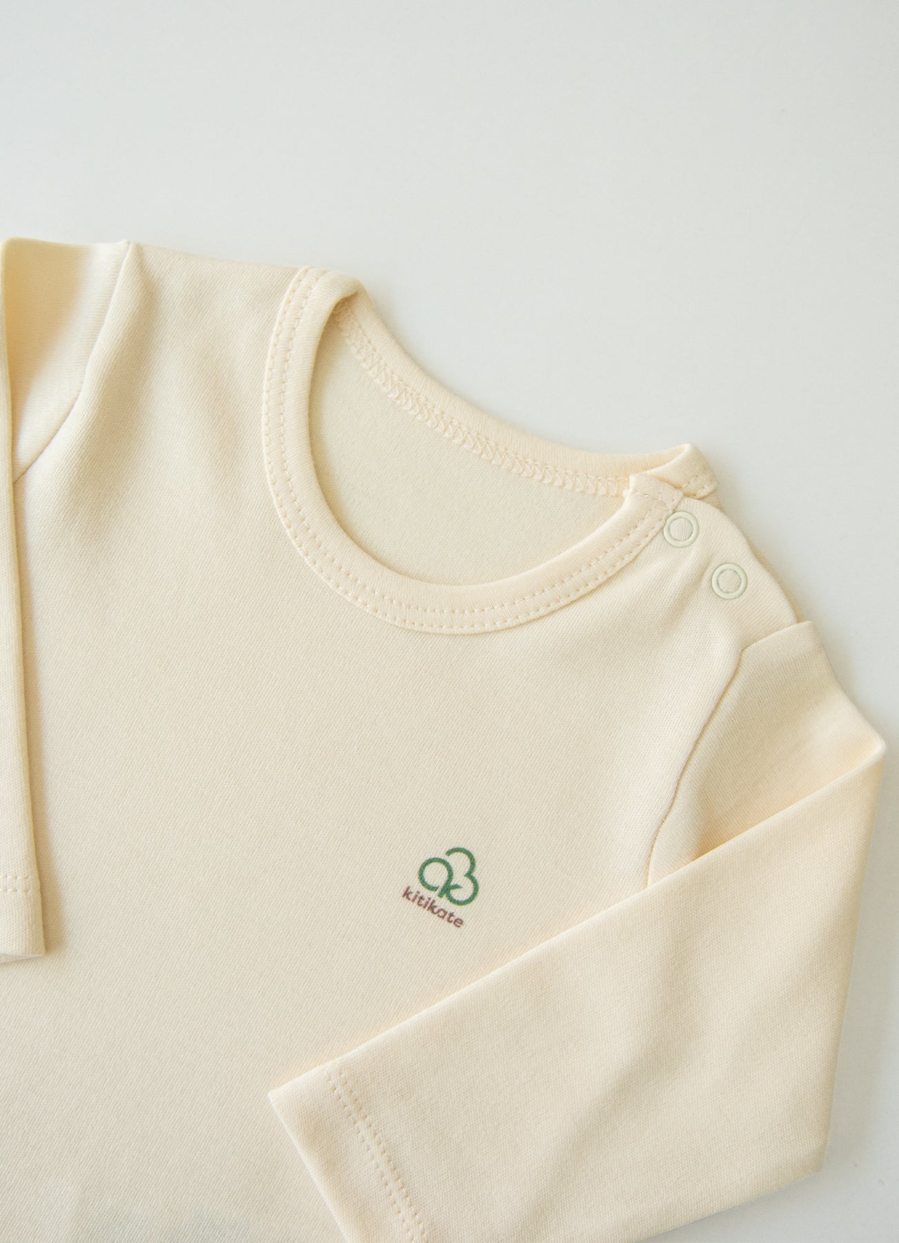 Organic New Basic Verlängerbares Langarm-Body Cremeweiß